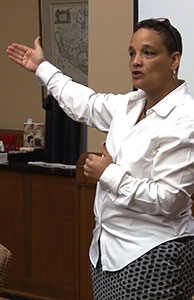 Image of a woman speaking Image of a woman speaking