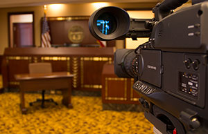 Image of a video camera in a courtroom.