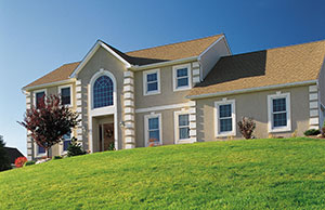Image of a home on a grassy property Image of a home on a grassy property