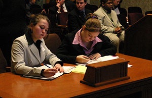 Image of students participating in a mock trial. Image of students participating in a mock trial.