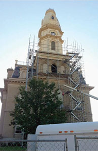Image of the exterior of the Logan County courthouse with scaffolding in front of it as it undergoes repairs Image of the exterior of the Logan County courthouse with scaffolding in front of it as it undergoes repairs