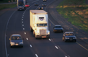Image of cars traveling on a highway Image of cars traveling on a highway