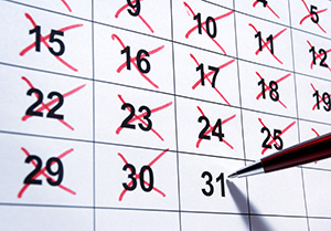 Image of a calendar with days crossed off in red