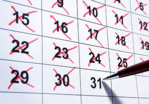 Image of a calendar with days crossed off in red Image of a calendar with days crossed off in red