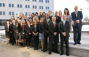 Large group of people posing outside