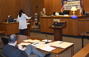 Image of a man speaking from a podium in a courtroom of the Cleveland Municipal Court Image of a man speaking from a podium in a courtroom of the Cleveland Municipal Court