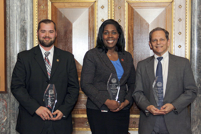 Image of three Ohio Supreme Court employees holding their Professional Excellence awards Image of three Ohio Supreme Court employees holding their Professional Excellence awards