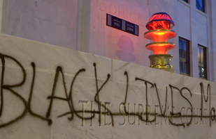 Image of the front of the Thomas J. Moyer Ohio Judicial Center showing where vandals had spray painted