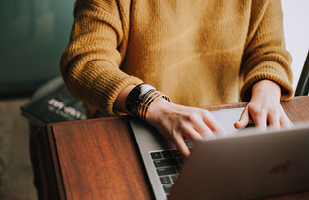 Image of a man using a laptop