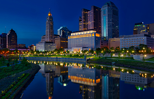 Evening view of the Moyer Judicial Center with a view of downtown Columbus in the background