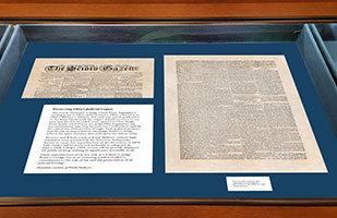 A display case containing historical documents.