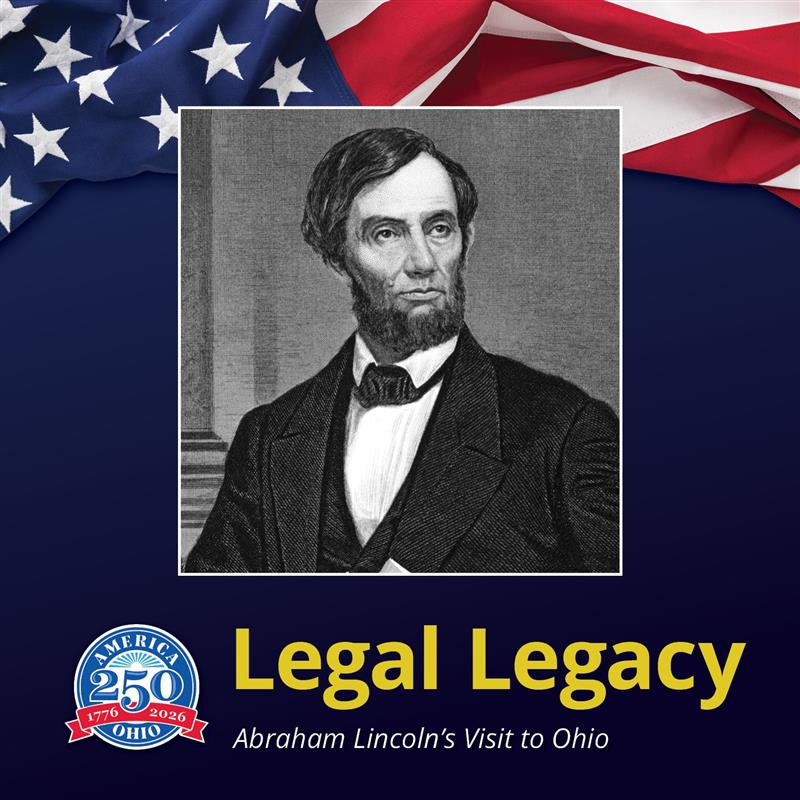 A man holding a paper in one hand and resting his other eblow on a stack of books