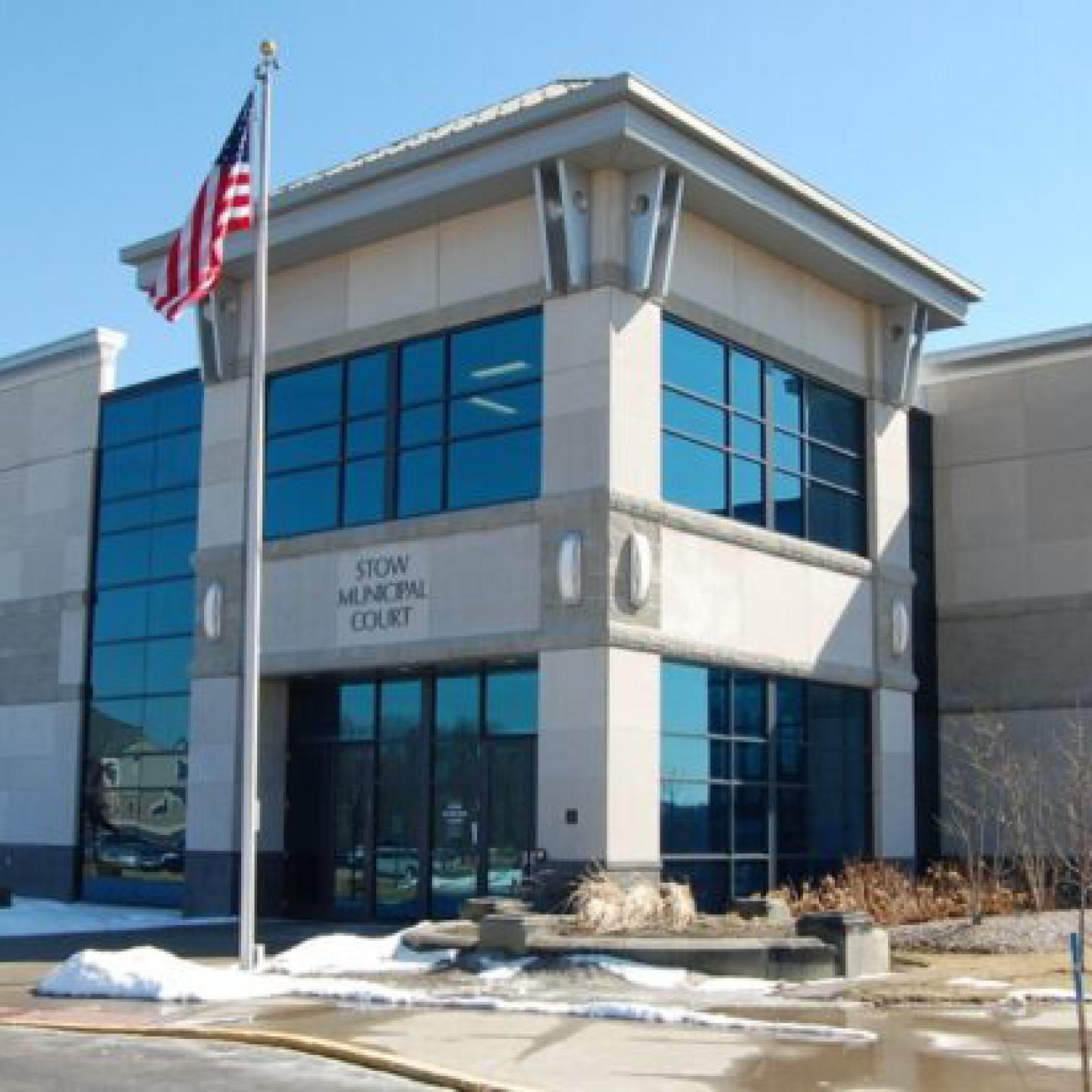 An exterior shot of the Stow Municipal Court building on a clear, sunny day.