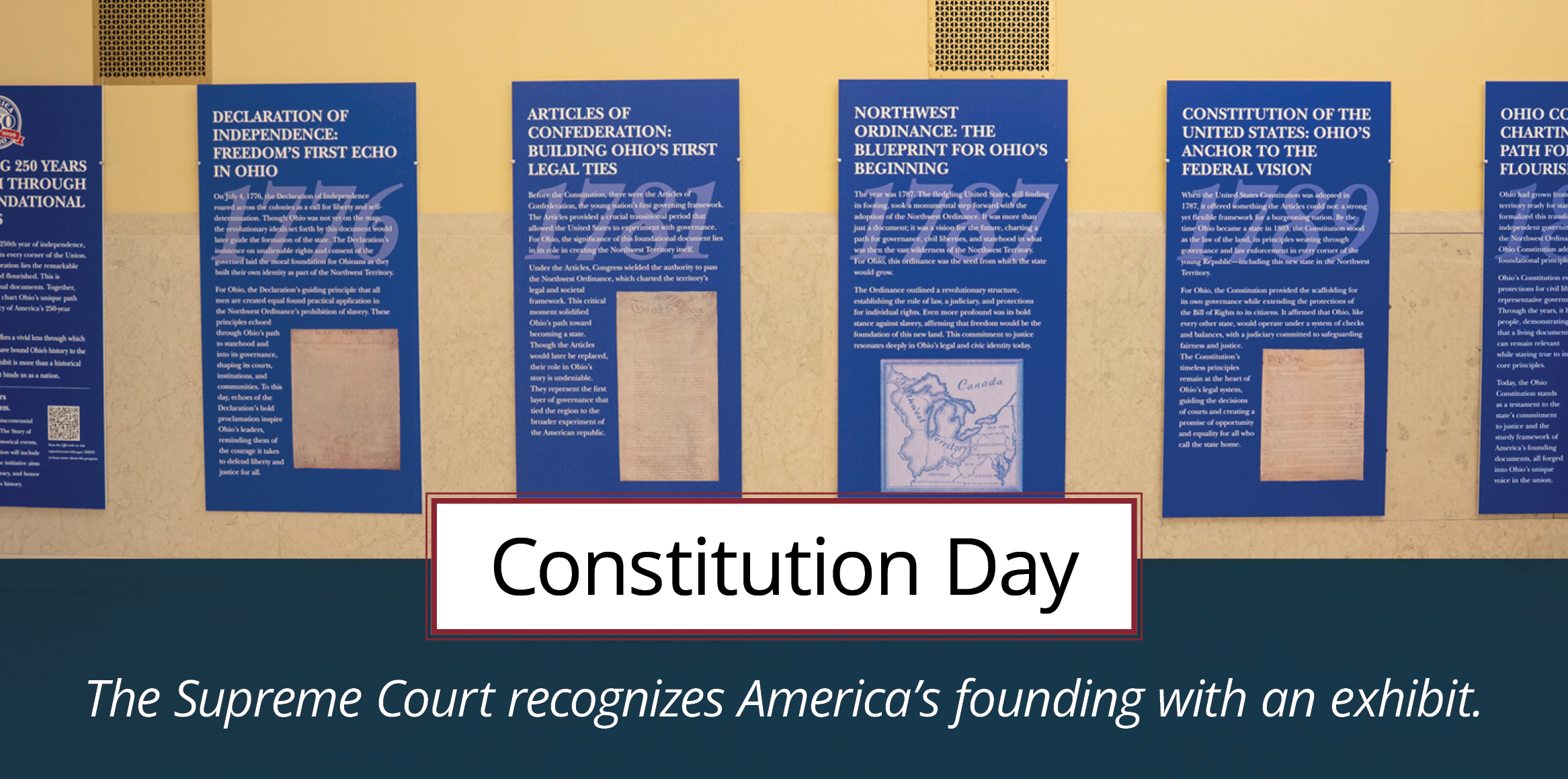 Six plaques in a museum with history facts about America and highlighting America's 250th birthday