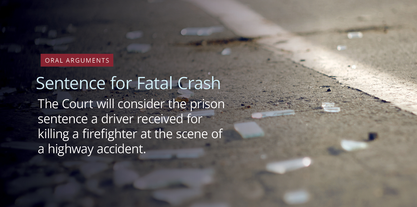 Shards of broken glass on asphault.