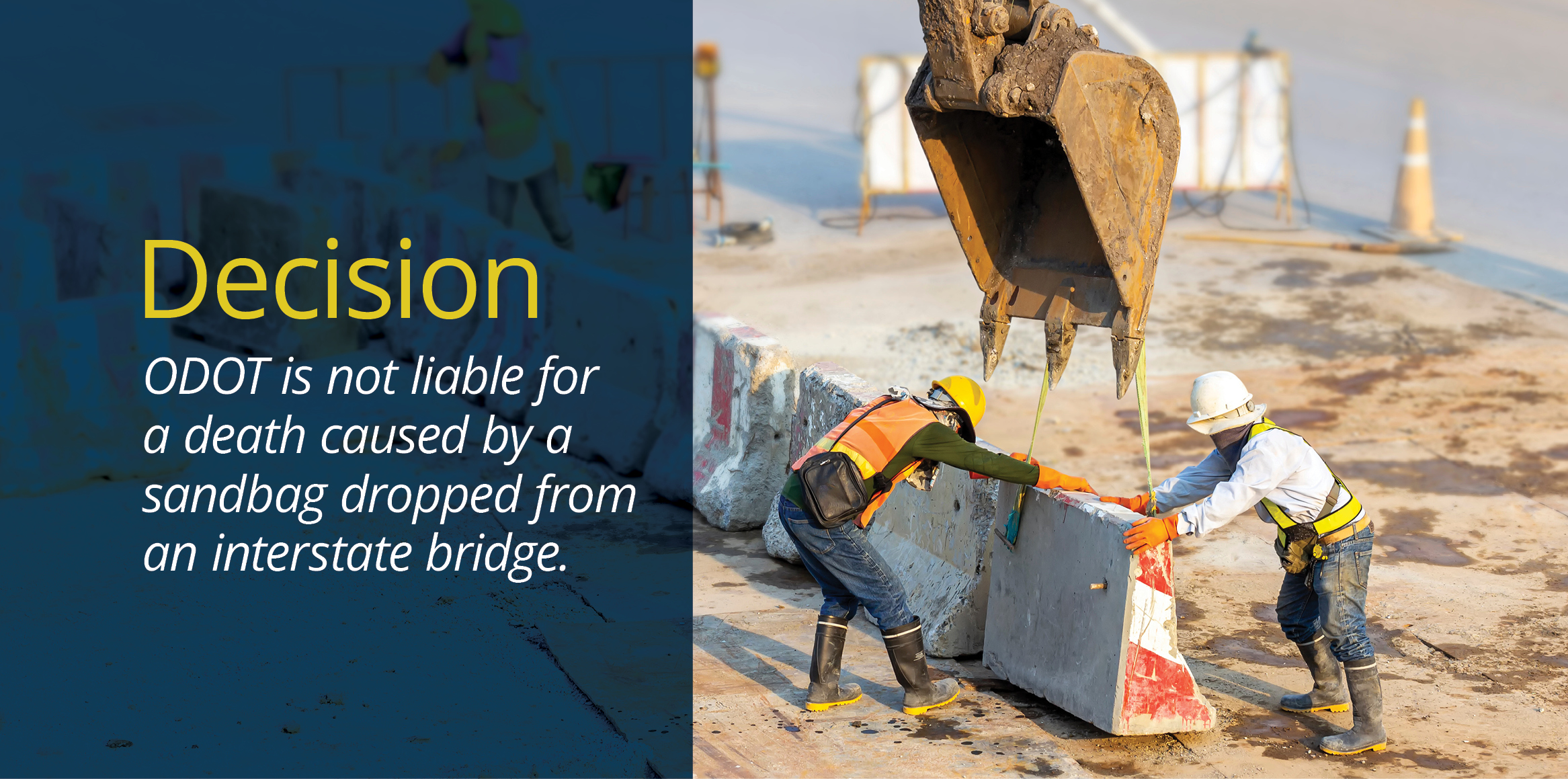 An orange-vested worker wearing blue jeans and black boots guides a large concrete barrier being lifted by an excavator bucket, while a white-helmeted worker balances the other side.