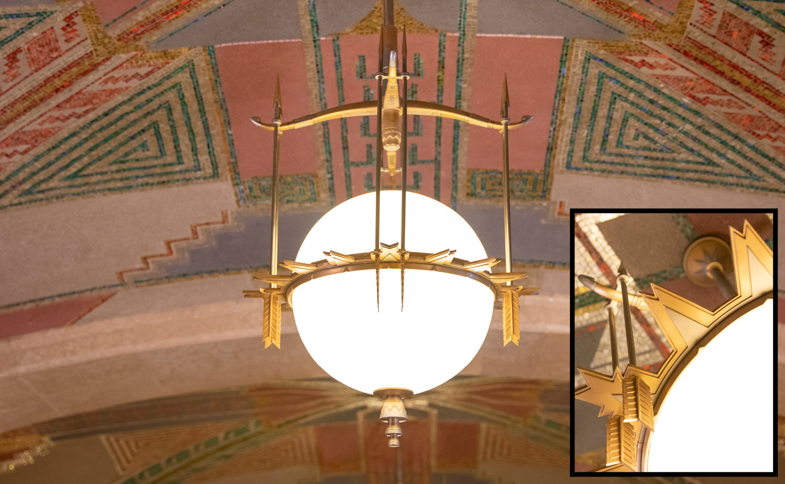 Image of light fixtures with an inset of the light fixture details featuring nickel and bronze arrows