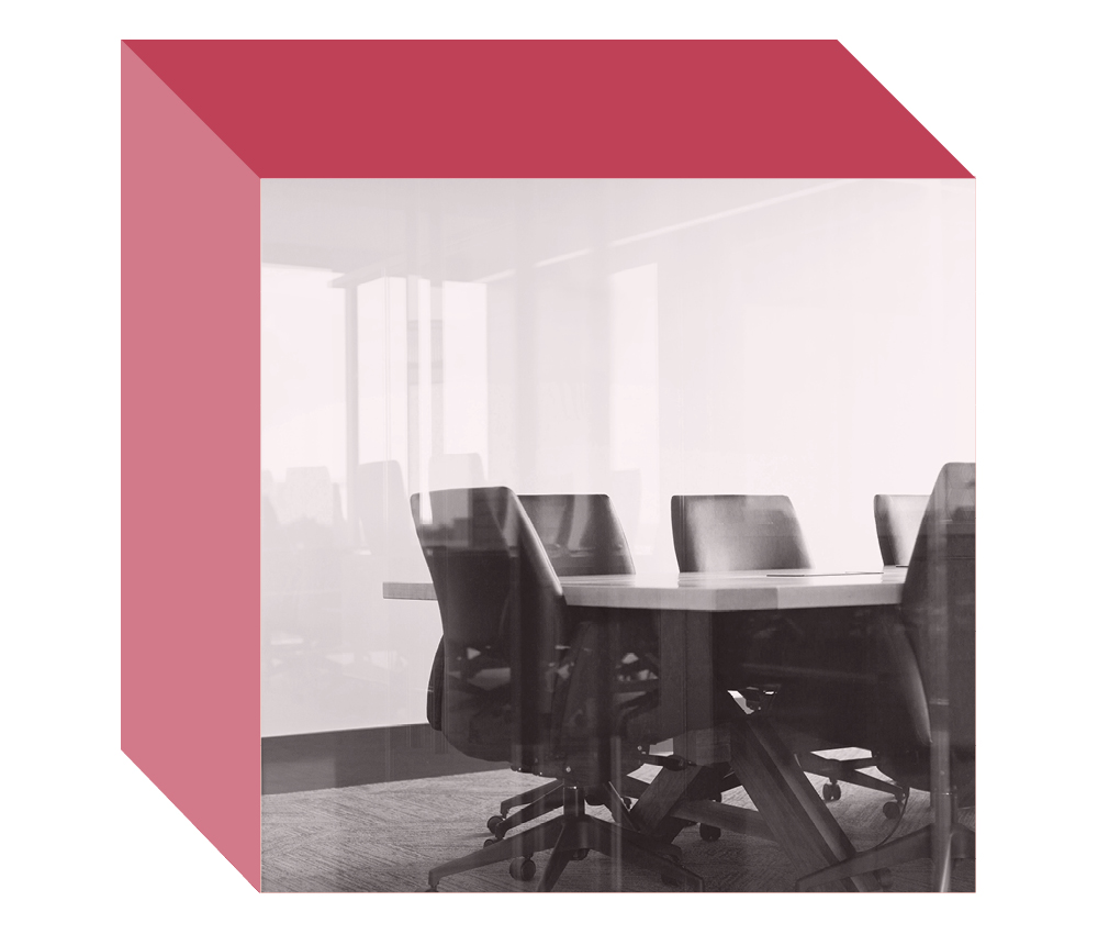 Image of a conference room table and chairs on the front-facing side of a multi-dimensional cube