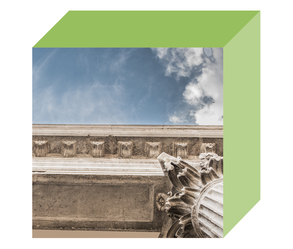 Image of the top of a concrete pillar in front of a blue sky with white clouds on the front-facing side of a multi-dimensional cube