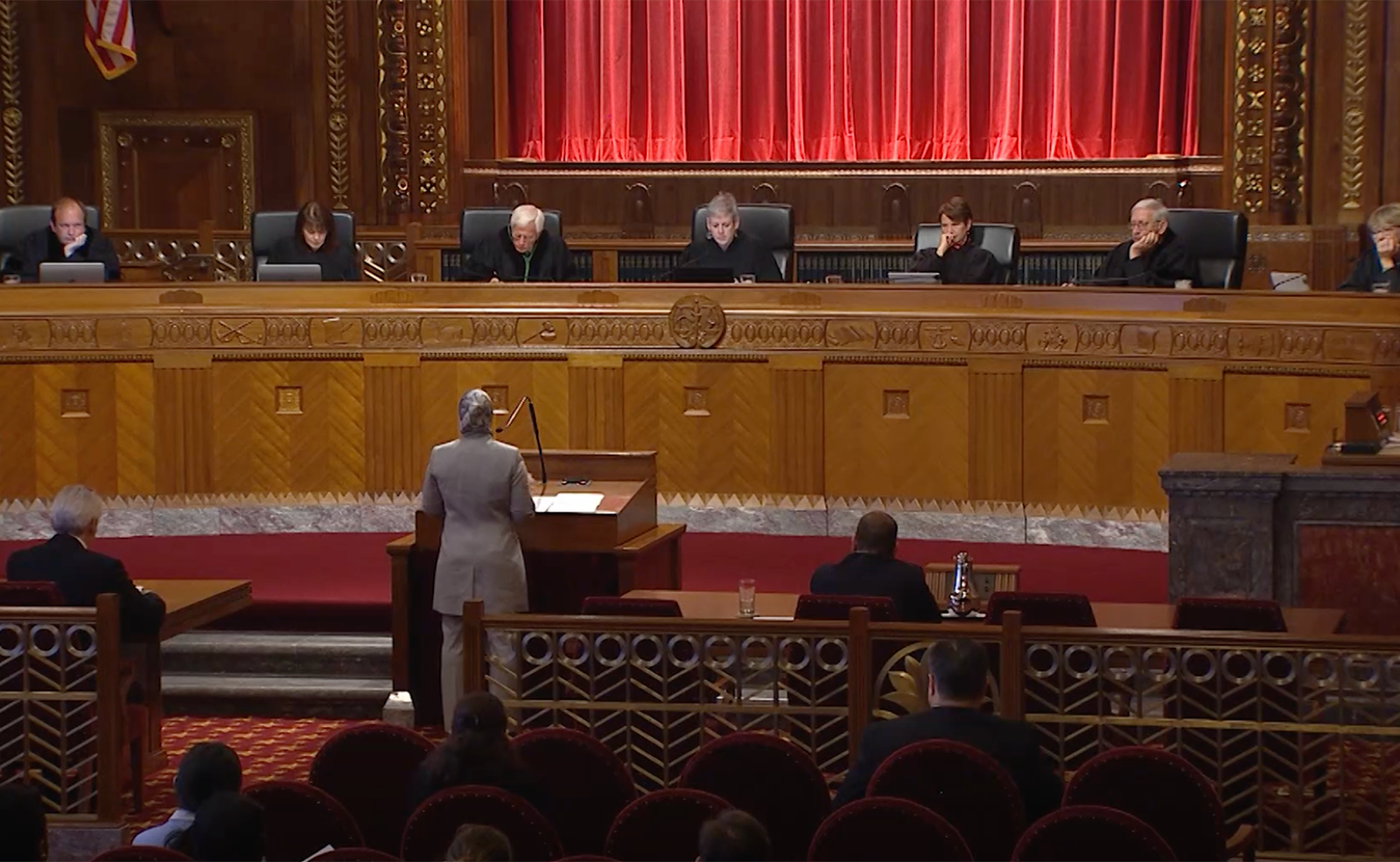 Image the Chief Justice and Justices listening to oral arguments from the bench in the courtroom of the Thomas J. Moyer Ohio Judicial Center