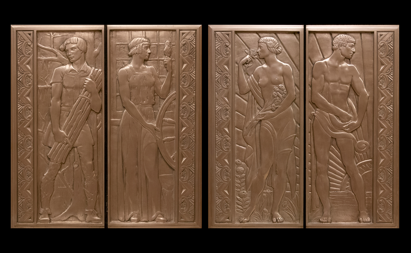 Image of a set of ornate, bronze elevator doors featuring male and female figures