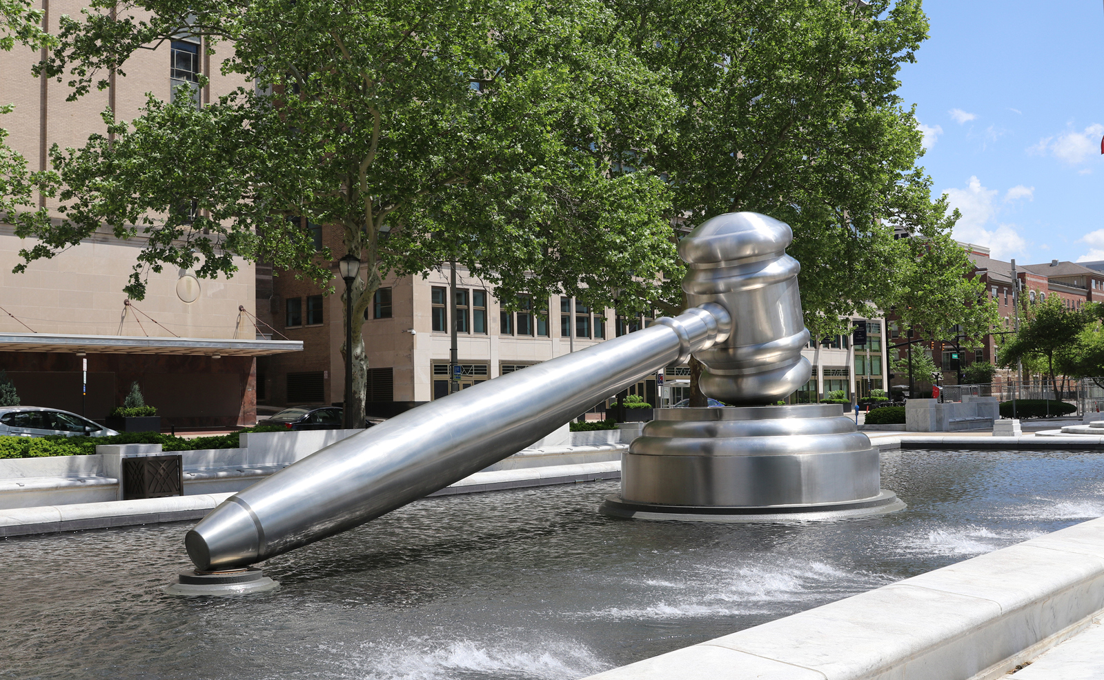 Image of the large stainless steel gavel located in the south reflecting pool of the Thomas J. Moyer Ohio Judicial Center