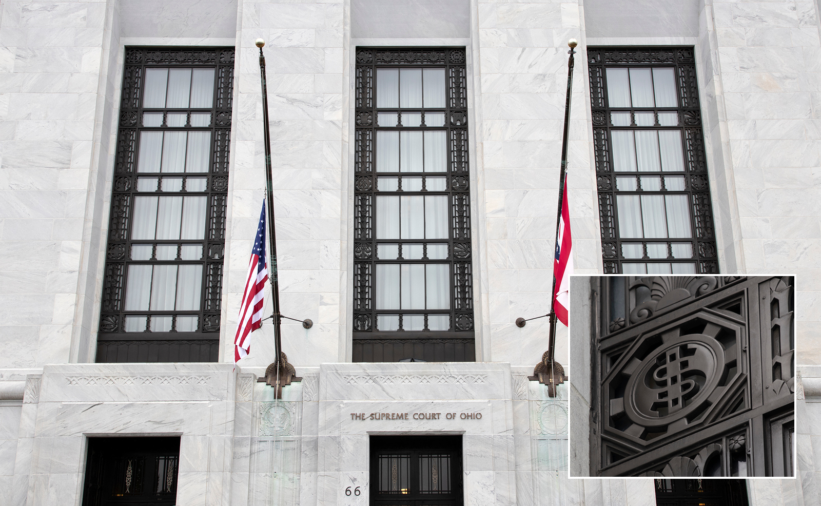 Image of the west side of the Thomas J. Moyer Ohio Judicial Center showing three large windows surrounded by intricate metal grill work and the United States and Ohio flags