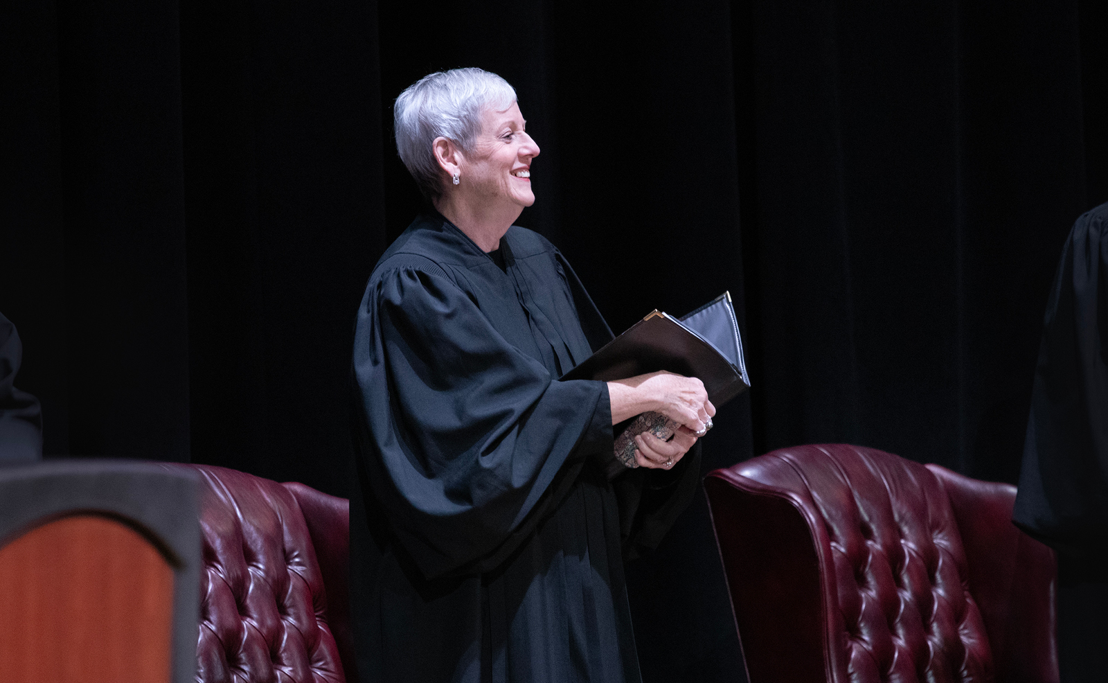 Image of a female justice wearing her black judicial robe smiling