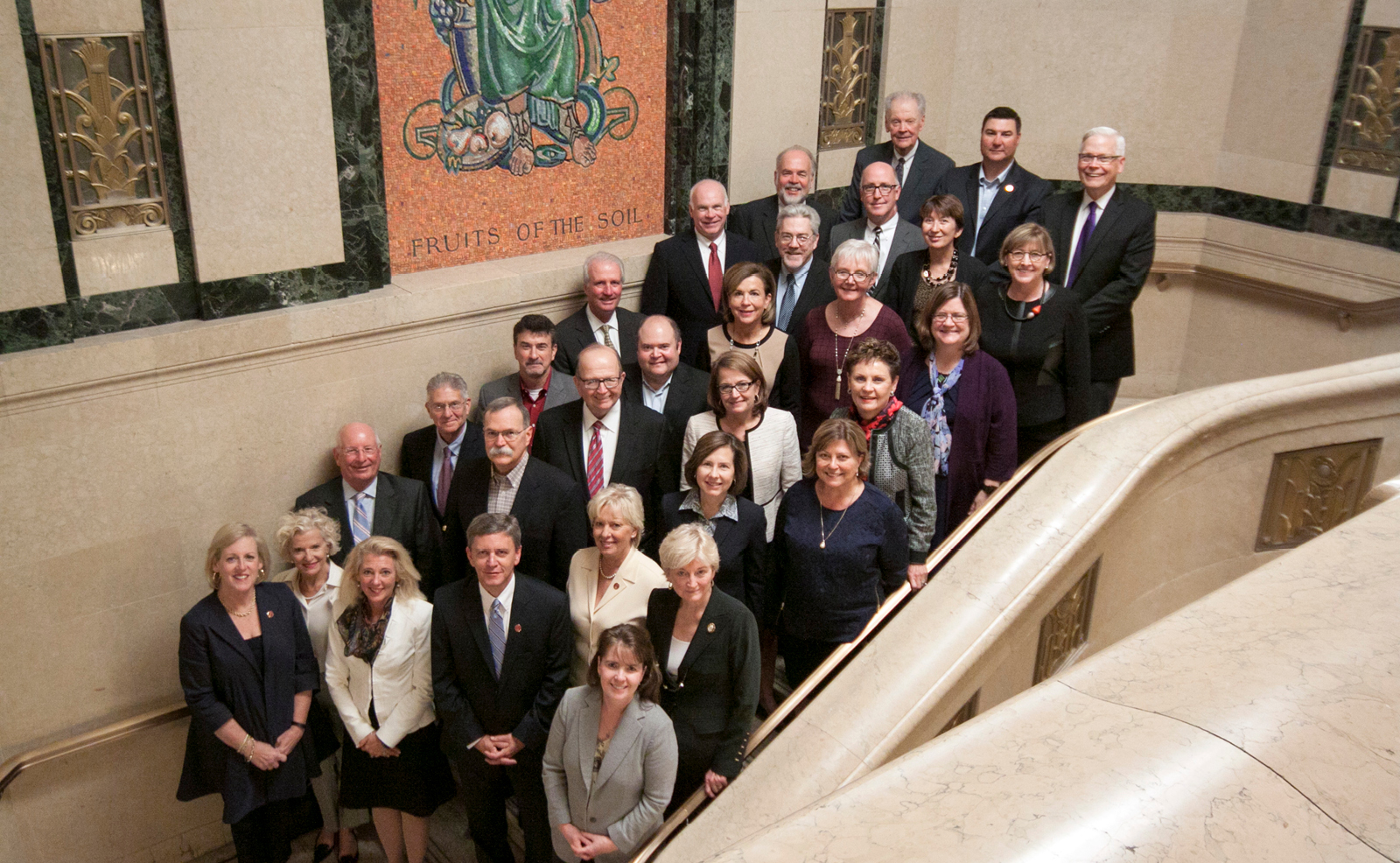 Image of a group of men and women standing on a staircase within the Thomas J. Moyer Ohio Judicial Center