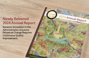 A booklet sitting on a desk with the title '2024 annual report' with the Supreme Court of Ohio seal in the top corner of the page.