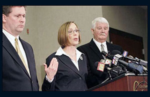 From left: Dr. Russell Uptegrove, Warren County Coroner, the late Judge Rachel A. Hutzel, and Ron Ferrell, Mason Police Chief. Photo: Cincinnati Enquirer. Used with permission. From left: Dr. Russell Uptegrove, Warren County Coroner, the late Judge Rachel A. Hutzel, and Ron Ferrell, Mason Police Chief. Photo: Cincinnati Enquirer. Used with permission.